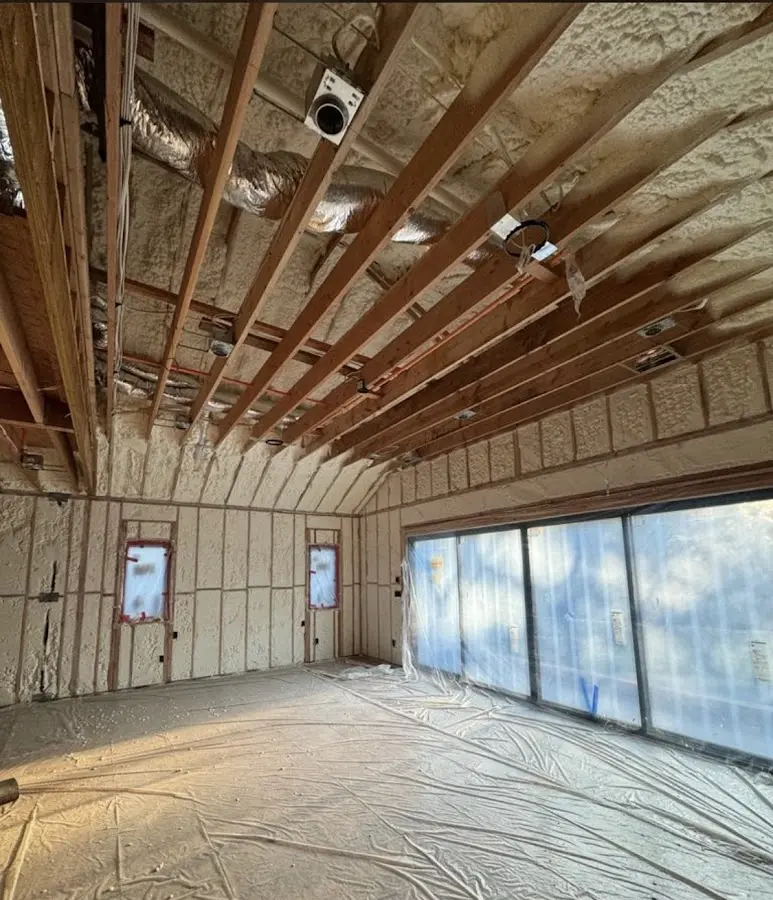 Interior walls and ceiling insulated with spray foam during new construction in Stonington