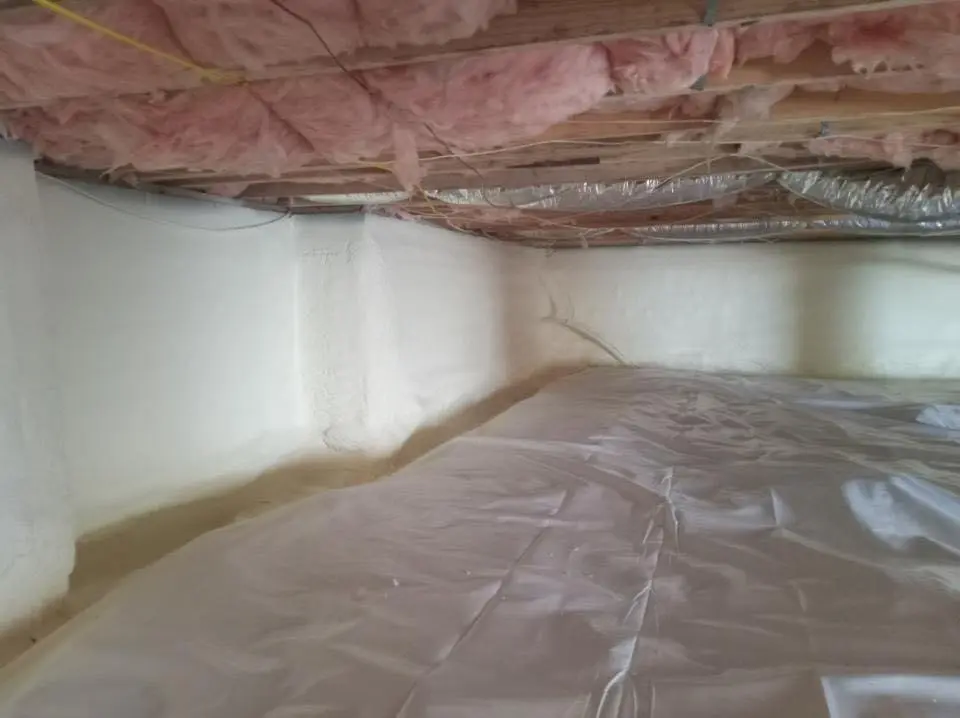 Crawl space encapsulation with closed-cell spray foam for Commercial Roof Restoration in Stonington